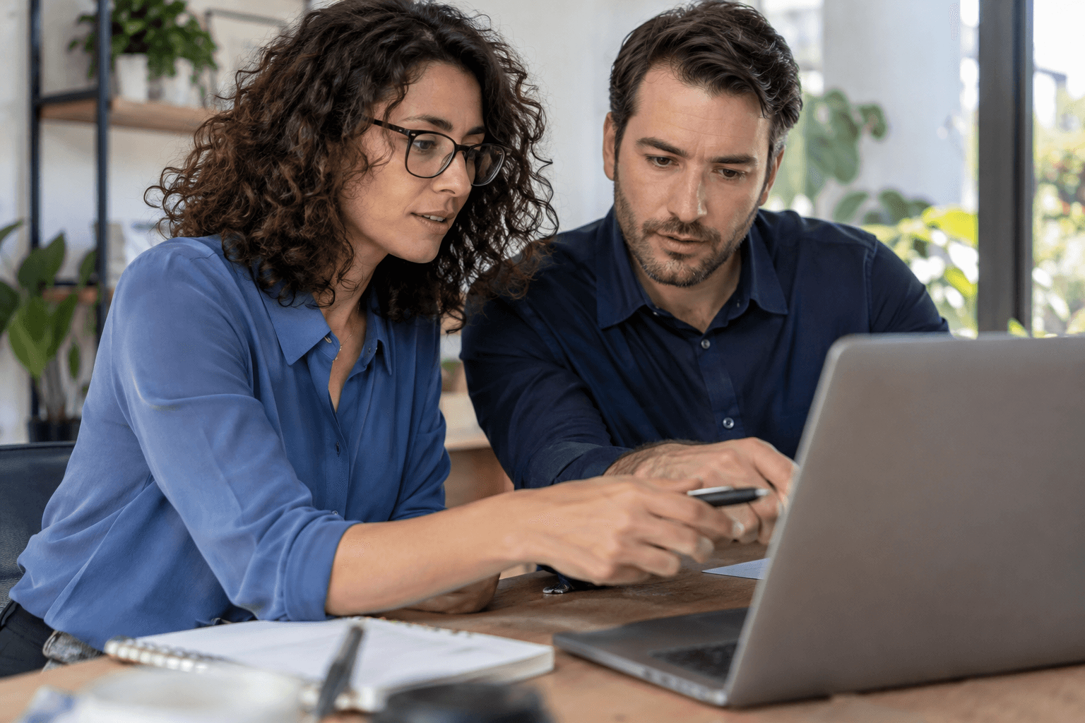 A lead research specialist reviewing prospects with a colleague